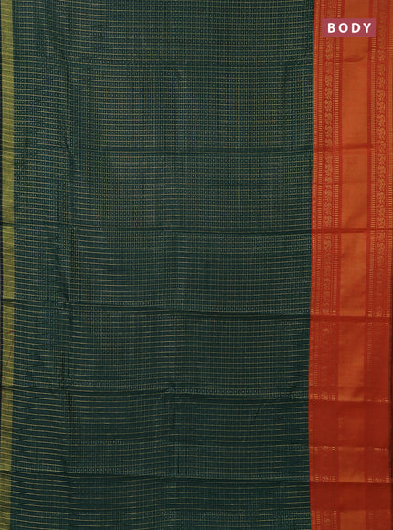 Semi dupion saree green and orange with allover zari checks & buttas and long zari woven border