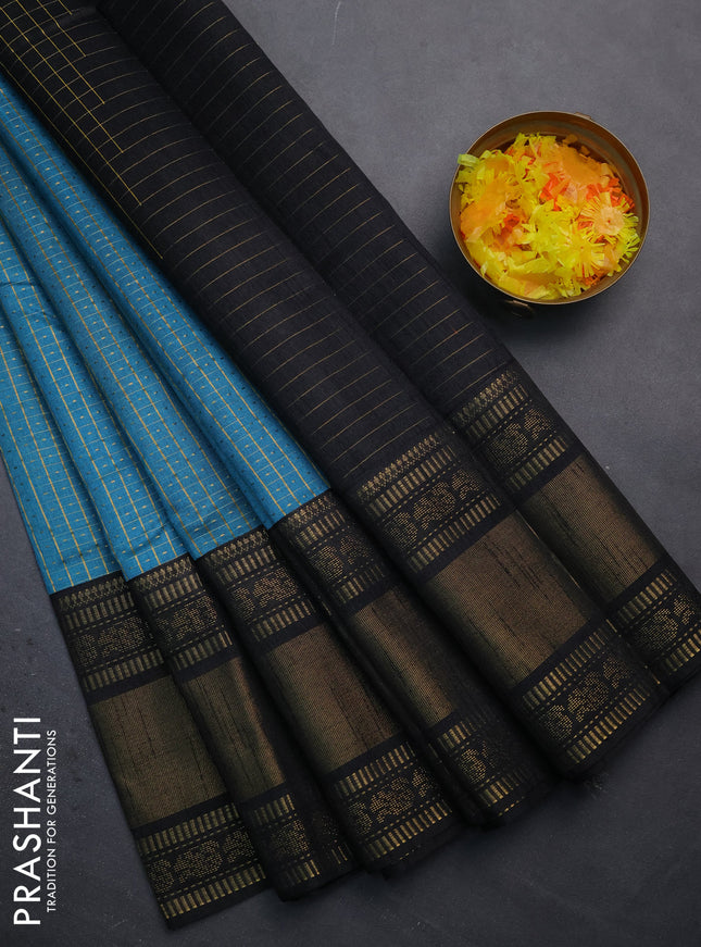 Semi dupion saree teal blue and black with allover zari checks & buttas and long zari woven border