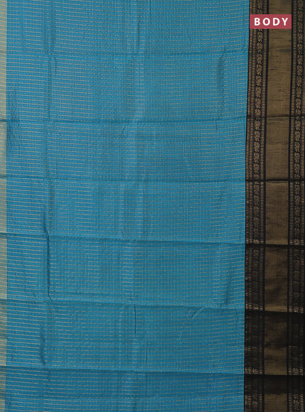 Semi dupion saree teal blue and black with allover zari checks & buttas and long zari woven border