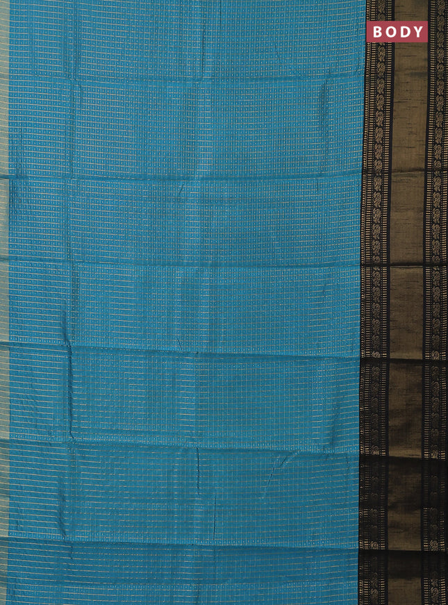 Semi dupion saree teal blue and black with allover zari checks & buttas and long zari woven border