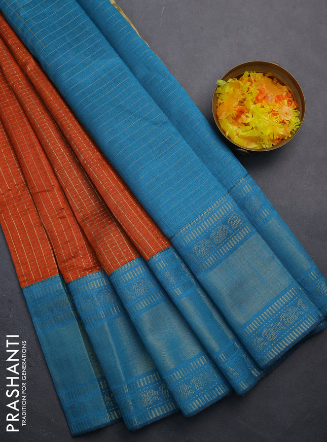Semi dupion saree orange and teal blue with allover zari checks & buttas and long zari woven border