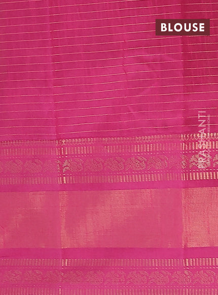 Semi dupion saree green and magenta pink with allover zari checks & buttas and long zari woven border