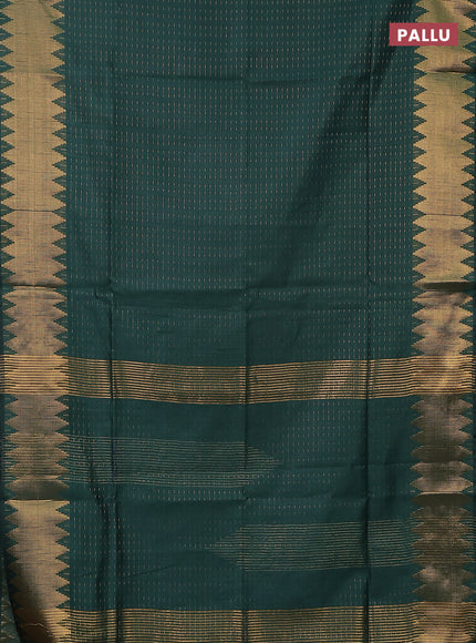 Semi dupion saree bottle green with allover zari woven buttas and temple zari woven border