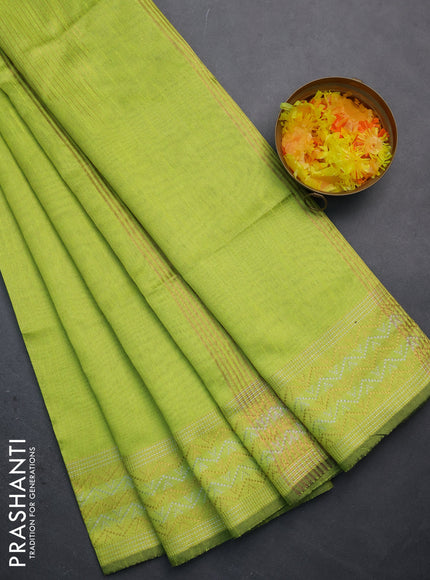 Semi dupion saree fluorescent green with plain body and silver & gold zari woven border