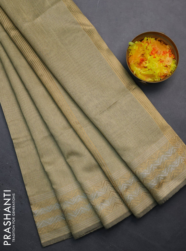 Semi dupion saree beige with plain body and silver & gold zari woven border