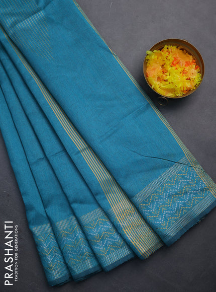 Semi dupion saree teal blue with plain body and silver & gold zari woven border