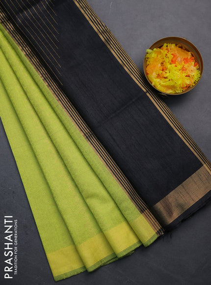 Semi dupion saree fluorsecntgreen and black with allover zari weaves and zari woven border