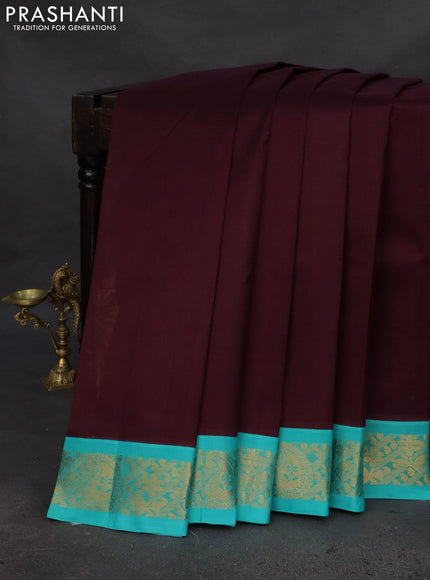 Silk cotton saree deep maroon and teal blue with plain body and zari woven korvai border