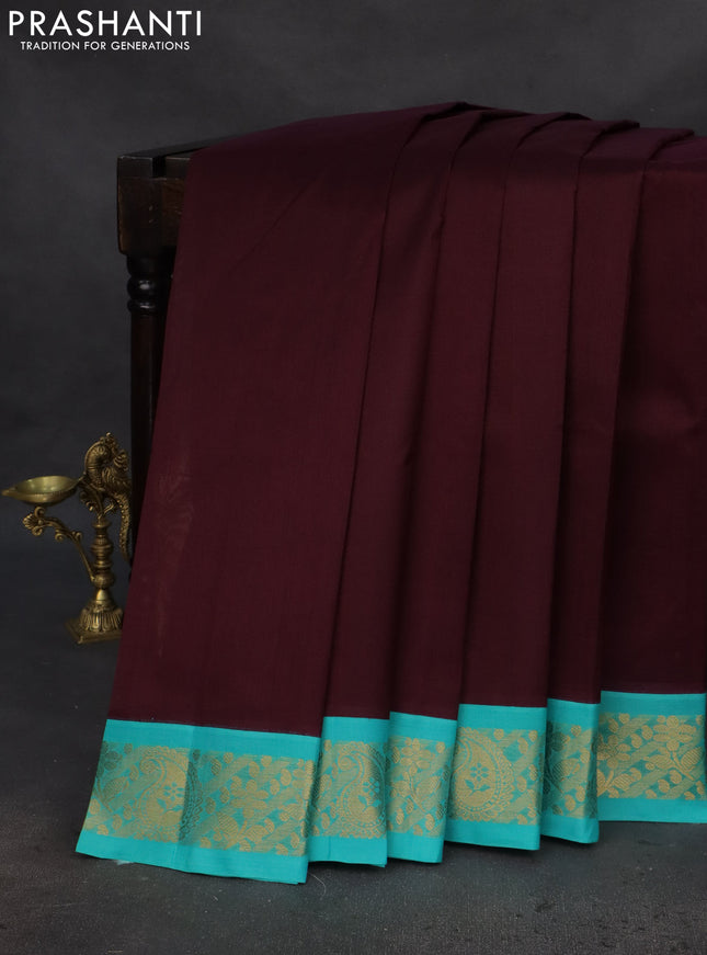 Silk cotton saree deep maroon and teal blue with plain body and zari woven korvai border