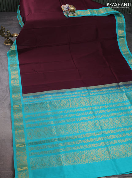 Silk cotton saree deep maroon and teal blue with plain body and zari woven korvai border