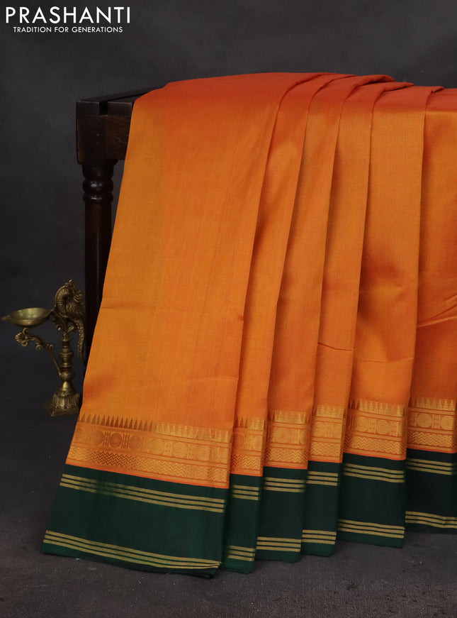 Silk cotton saree orange and green with plain body and zari woven simple border