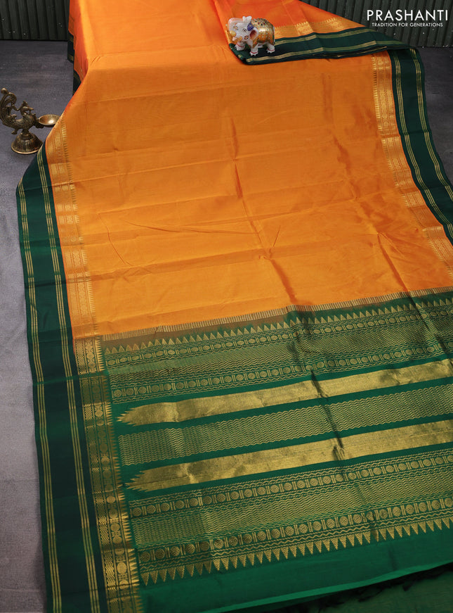 Silk cotton saree orange and green with plain body and zari woven simple border