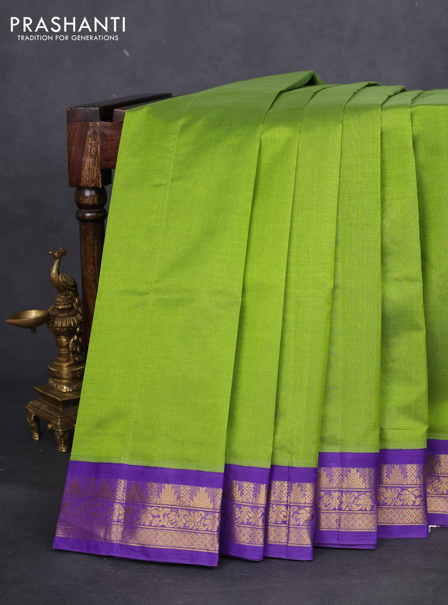 Silk cotton saree light green and violet with plain body and zari woven korvai border