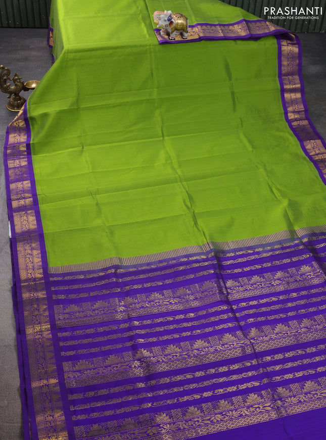 Silk cotton saree light green and violet with plain body and zari woven korvai border