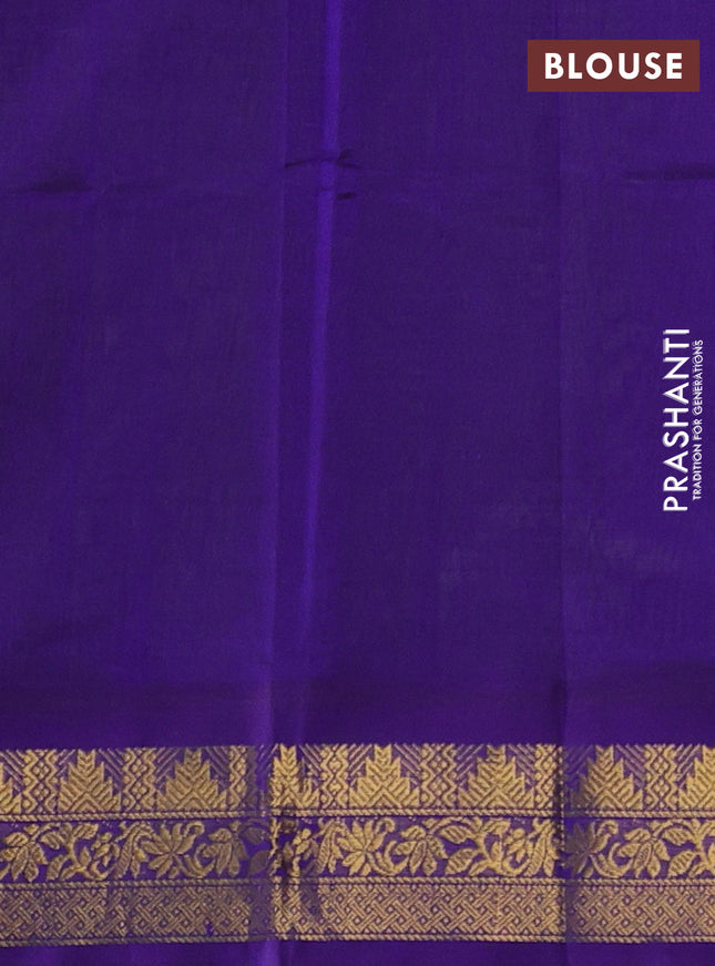 Silk cotton saree light green and violet with plain body and zari woven korvai border