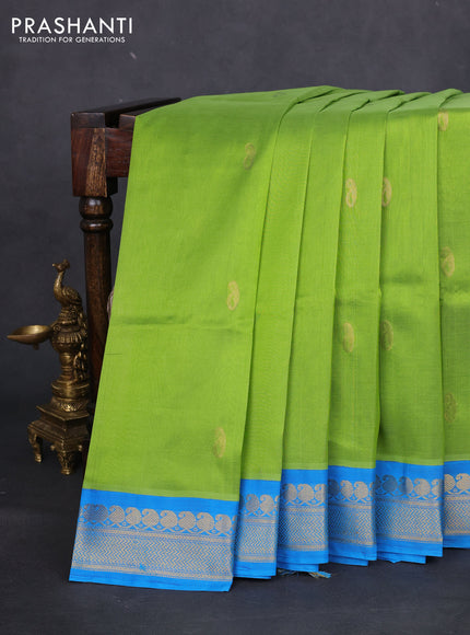 Silk cotton saree light green and cs blue with pailsey zari woven buttas and zari woven korvai border