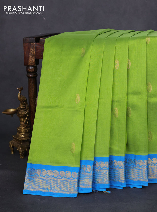 Silk cotton saree light green and cs blue with pailsey zari woven buttas and zari woven korvai border