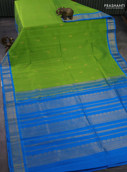 Silk cotton saree light green and cs blue with pailsey zari woven buttas and zari woven korvai border