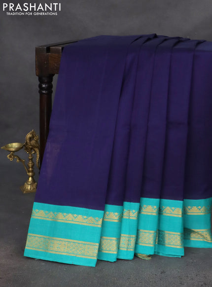 Silk cotton saree navy blue and teal green with plain body and zari woven korvai border