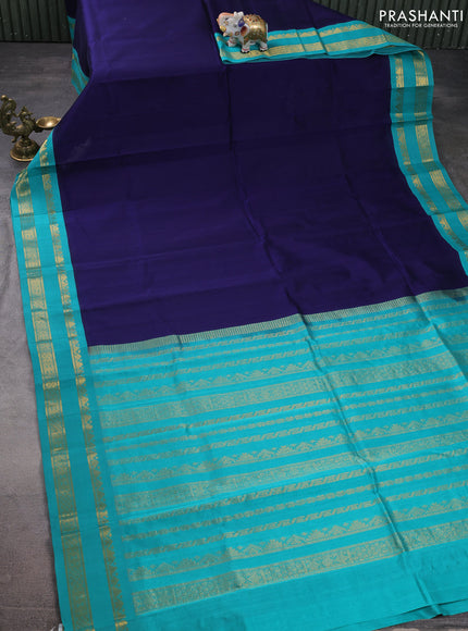 Silk cotton saree navy blue and teal green with plain body and zari woven korvai border