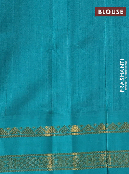 Silk cotton saree navy blue and teal green with plain body and zari woven korvai border