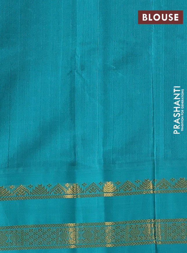 Silk cotton saree navy blue and teal green with plain body and zari woven korvai border