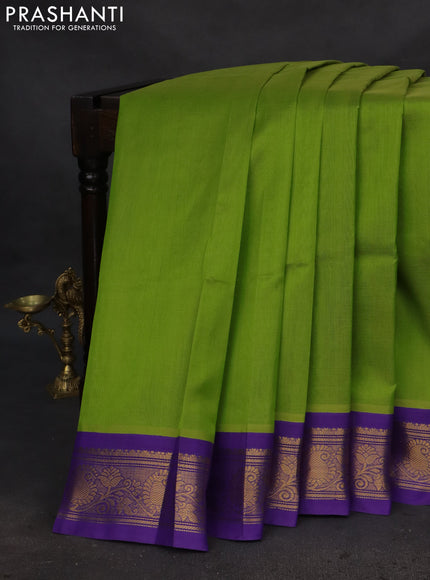 Silk cotton saree light green and violet with plain body and zari woven korvai border