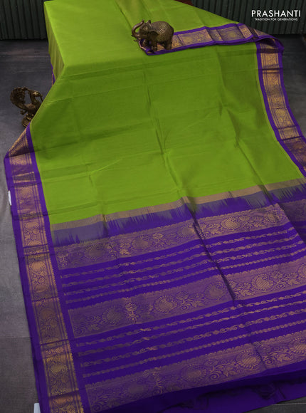 Silk cotton saree light green and violet with plain body and zari woven korvai border