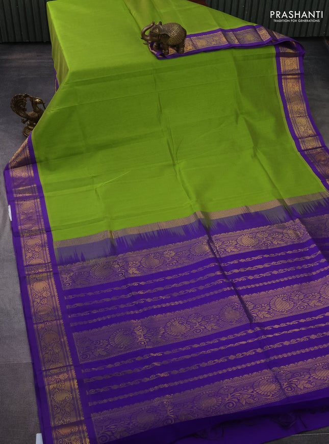 Silk cotton saree light green and violet with plain body and zari woven korvai border