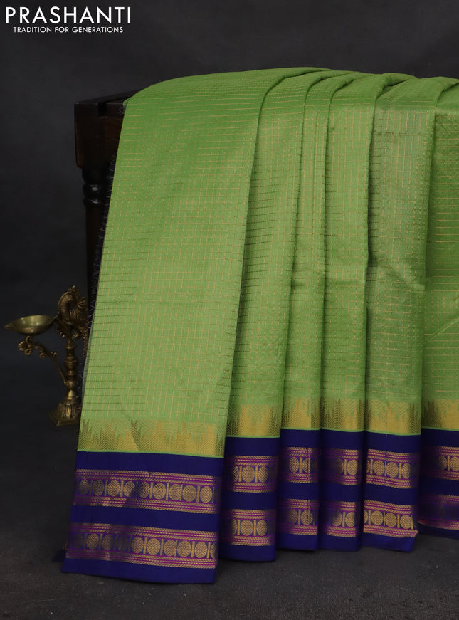 Silk cotton saree light green and blue with allover small zari checked pattern and temple design zari woven korvai border