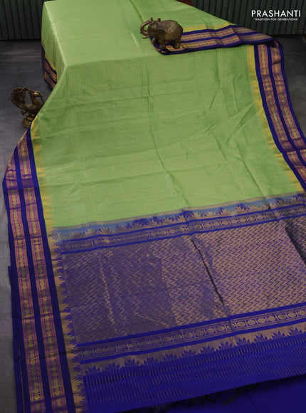 Silk cotton saree light green and blue with allover small zari checked pattern and temple design zari woven korvai border