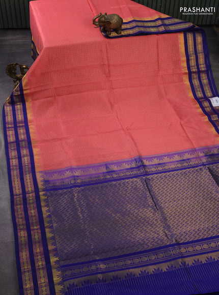 Silk cotton saree peach pink and blue with allover small zari checked pattern and temple design zari woven korvai border
