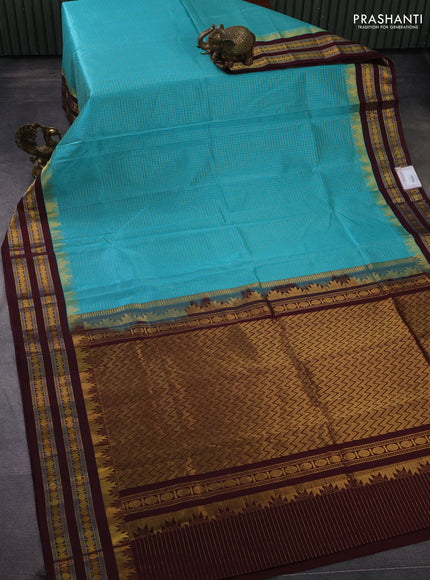 Silk cotton saree teal blue and brown with allover small zari checked pattern and temple design zari woven korvai border
