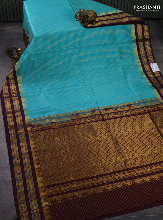 Silk cotton saree teal blue and brown with allover small zari checked pattern and temple design zari woven korvai border