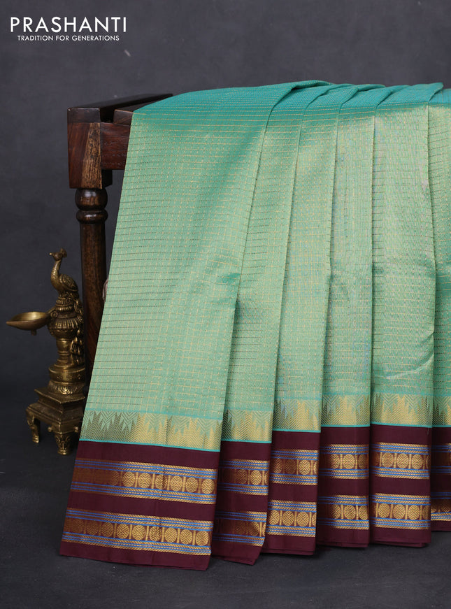 Silk cotton saree pastel green and deep maroon with allover small zari checked pattern and temple design zari woven korvai border