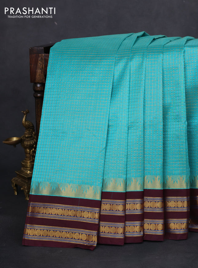 Silk cotton saree teal blue and deep maroon with allover small zari checked pattern and temple design zari woven korvai border