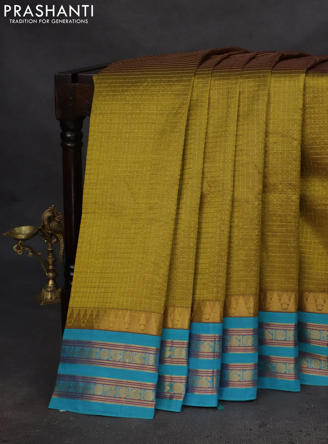 Silk cotton saree mehendi green and cs blue with allover small zari checked pattern and temple design zari woven korvai border