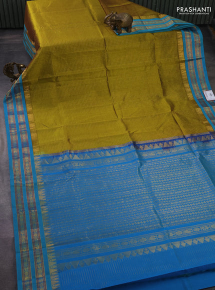 Silk cotton saree mehendi green and cs blue with allover small zari checked pattern and temple design zari woven korvai border