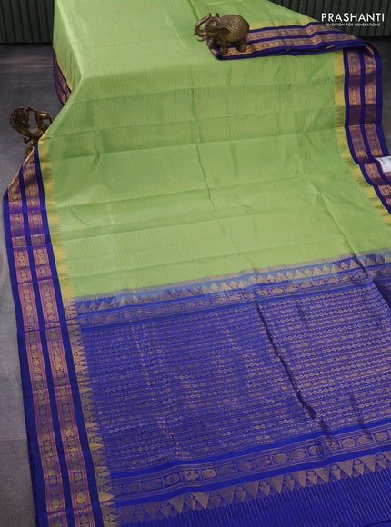 Silk cotton saree pista green and blue with allover small zari checked pattern and temple design zari woven korvai border