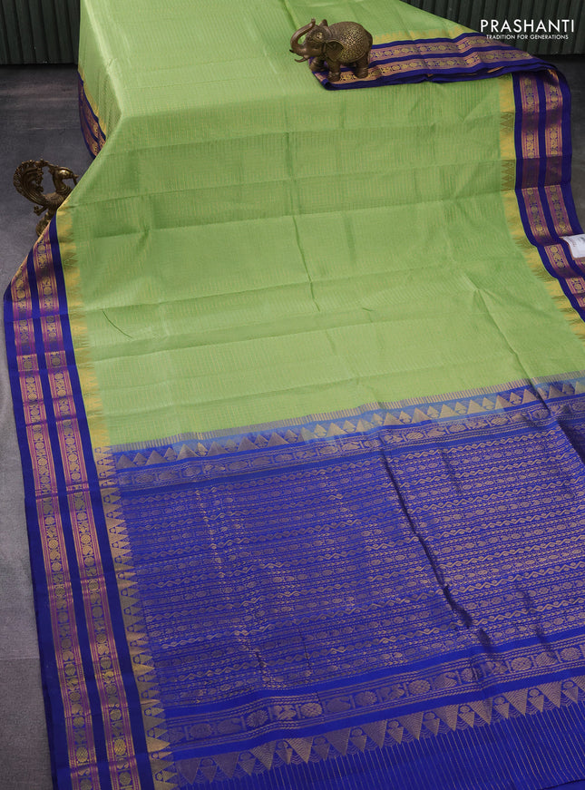 Silk cotton saree pista green and blue with allover small zari checked pattern and temple design zari woven korvai border