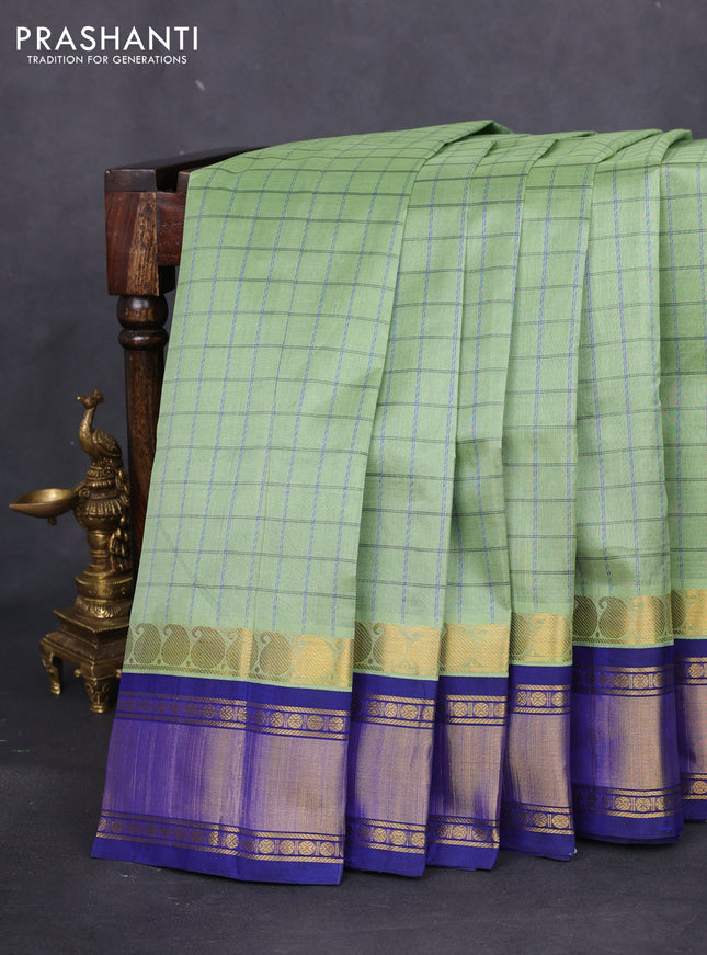 Silk cotton saree pastel green and blue with allover thread woven checked pattern and paisley zari woven korvai border