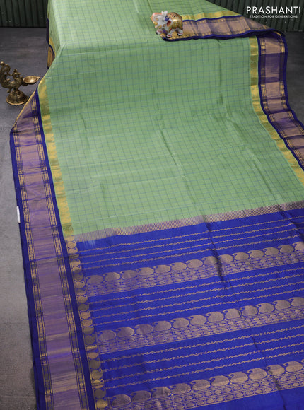 Silk cotton saree pastel green and blue with allover thread woven checked pattern and paisley zari woven korvai border