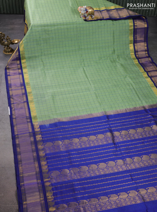 Silk cotton saree pastel green and blue with allover thread woven checked pattern and paisley zari woven korvai border