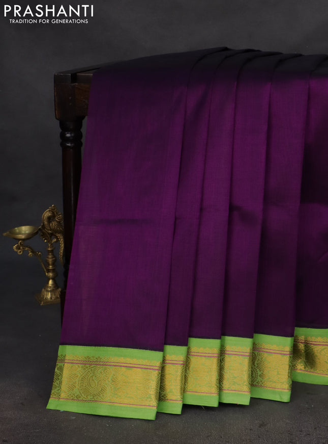 Silk cotton saree violet and light green with plain body and zari woven korvai border