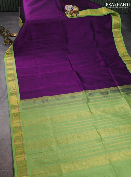 Silk cotton saree violet and light green with plain body and zari woven korvai border