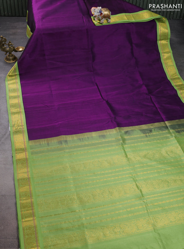 Silk cotton saree violet and light green with plain body and zari woven korvai border