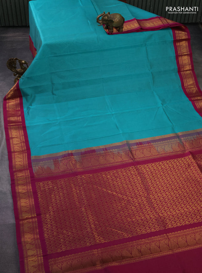 Silk cotton saree teal blue and magenta pink with allover vairaosi pattern and zari woven korvai border