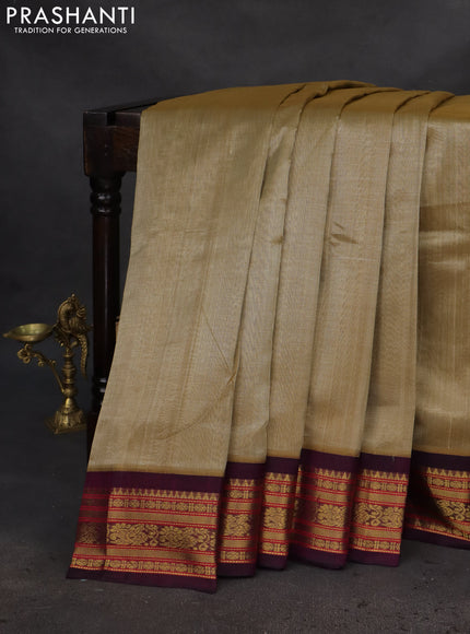 Silk cotton saree sandal and purple with plain body and zari woven korvai border