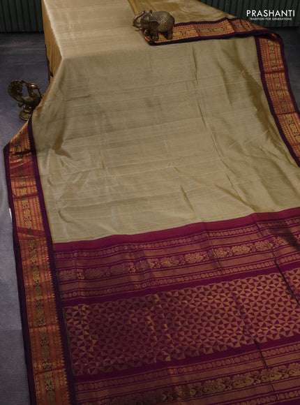 Silk cotton saree sandal and purple with plain body and zari woven korvai border