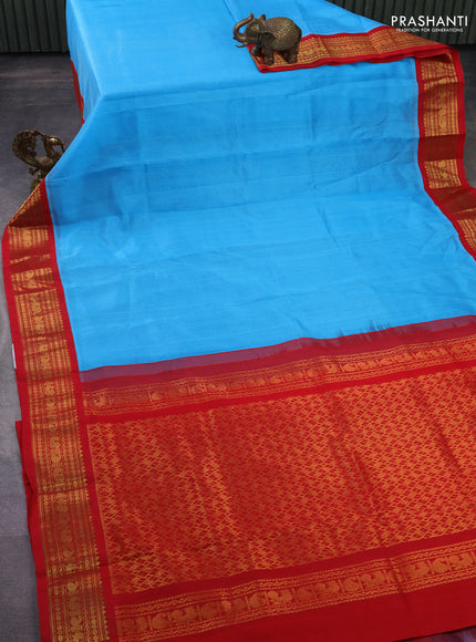 Silk cotton saree light blue and red with plain body and zari woven korvai border